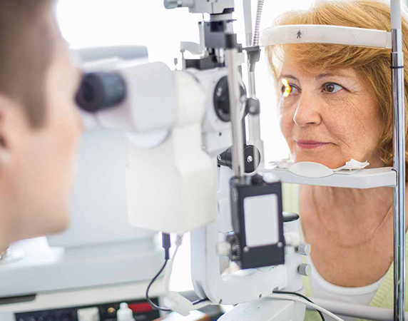 Patient receiving eye exam from eye doctor