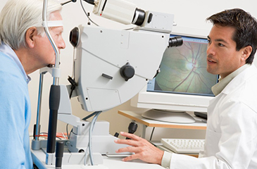 patient receiving eye exam from eye doctor