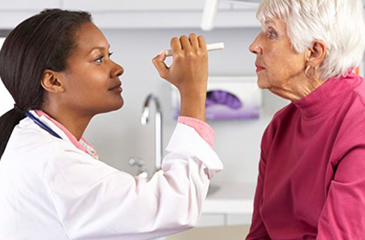 eye exam being performed by an eye doctor