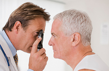 optometrist examining patient eye health through eye exam