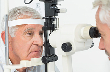 Patient receiving eye exam from eye doctor