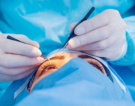 Doctor performing eye care on patient