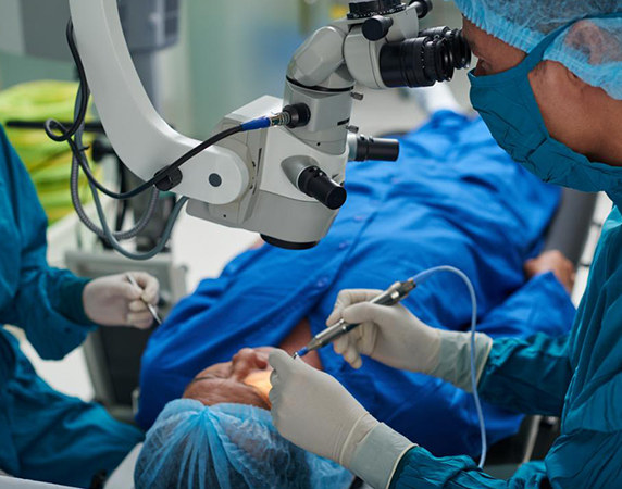 Doctor performing eye care on patient